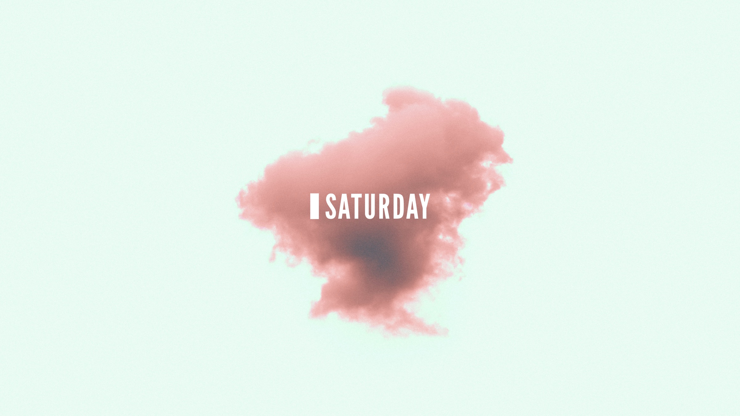 Saturday wordmark emerging through pink smoke